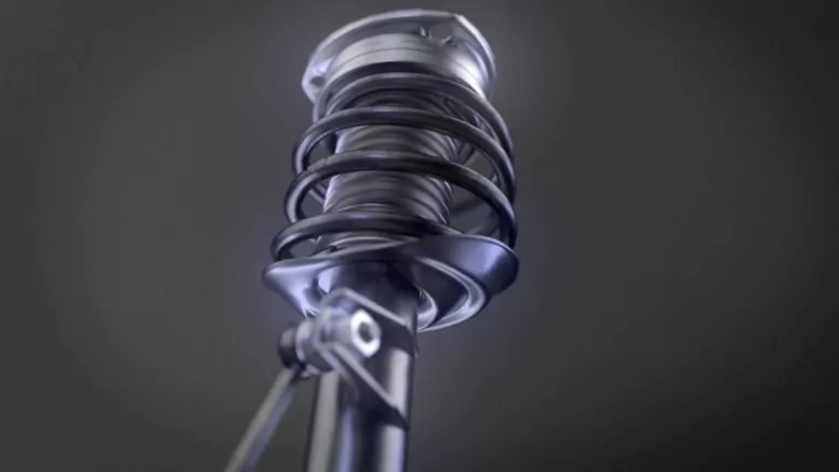 Nahaufnahme eines modernen, metallischen Mikrofons mit spiralförmiger Stoßdämpferbefestigung, inspiriert von Stoßdämpfer Fahrzeugsicherheit, vor einem dunklen, verschwommenen Hintergrund. Der niedrige Winkel betont das schlanke Design des Mikrofons.