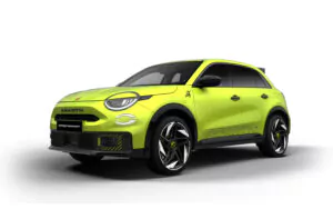 Ein leuchtend gelber Abarth Crossover-SUV wird auf einem weißen Hintergrund gezeigt. Das Auto hat sportliche schwarze und gelbe Akzente, kühne Räder und den ABARTH-Schriftzug auf dem Kühlergrill und den Seiten.